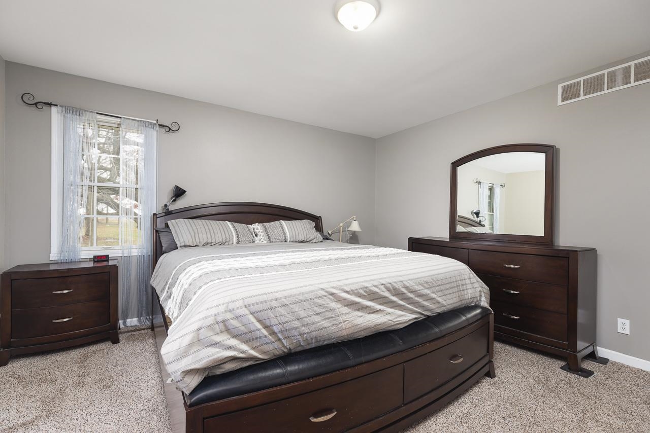 1011 North Dakota Road Ridott, IL 61067 - Photo 17 of 34 a bedroom with a bed and a window
