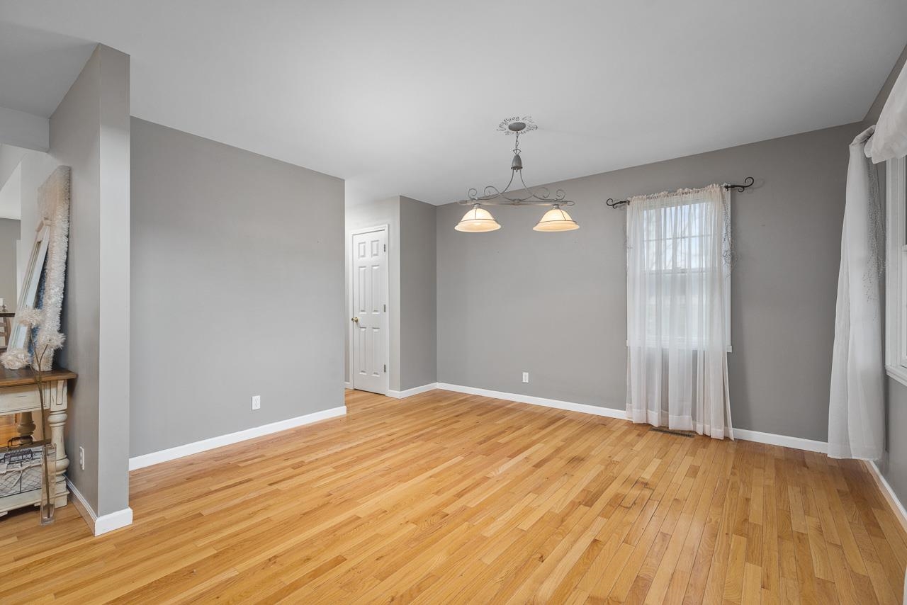 1011 North Dakota Road Ridott, IL 61067 - Photo 3 of 34 a view of empty room with wooden floor and fan