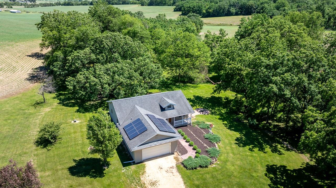 1011 North Dakota Road Ridott, IL 61067 - Photo 31 of 34 an aerial view of a house with a yard