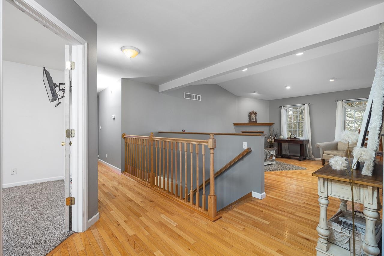 1011 North Dakota Road Ridott, IL 61067 - Photo 5 of 34 a view of a hallway with dining room and wooden floor