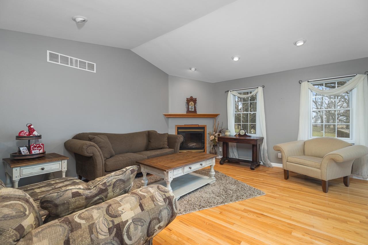 1011 North Dakota Road Ridott, IL 61067 - Photo 6 of 34 a living room with furniture window and a fireplace