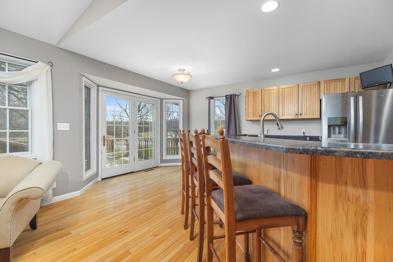 1011 North Dakota Road Ridott, IL 61067 - Photo 9 of 34 a dining room with furniture a window and wooden floor