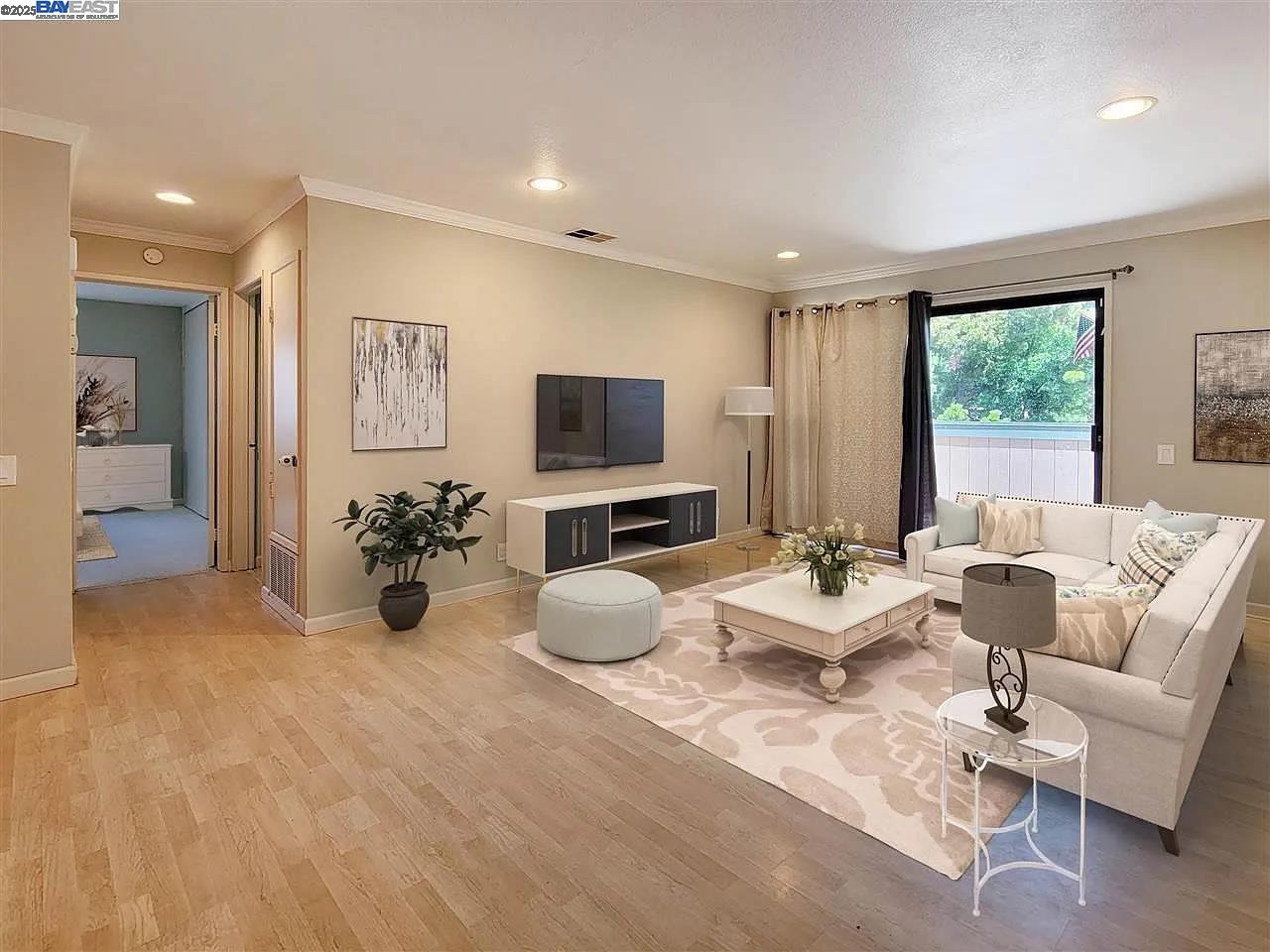 175 East Warren Common Fremont, CA 94539 - Photo 1 of 16 a living room with furniture and a flat screen tv