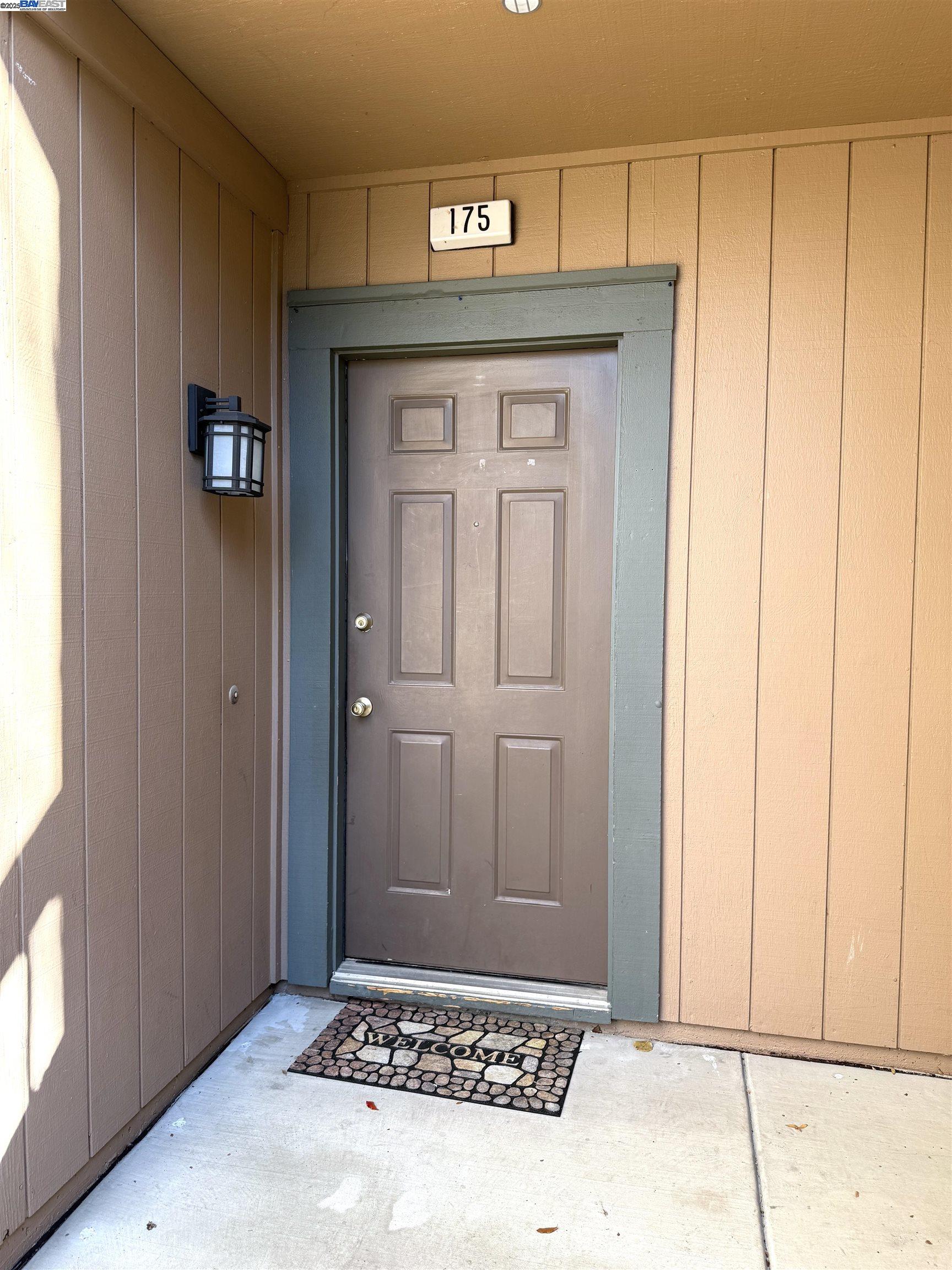 175 East Warren Common Fremont, CA 94539 - Photo 11 of 16 a bathroom with a granite countertop sink and a mirror