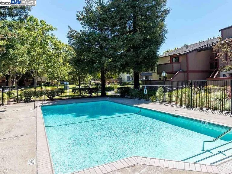 175 East Warren Common Fremont, CA 94539 - Photo 15 of 16 a view of backyard with swimming pool and green space