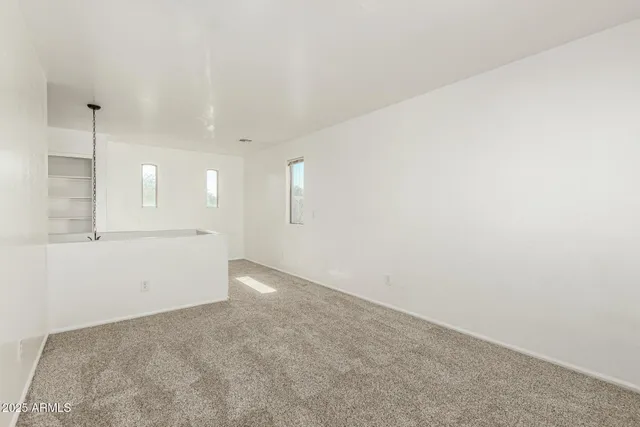 a view of an empty room and window