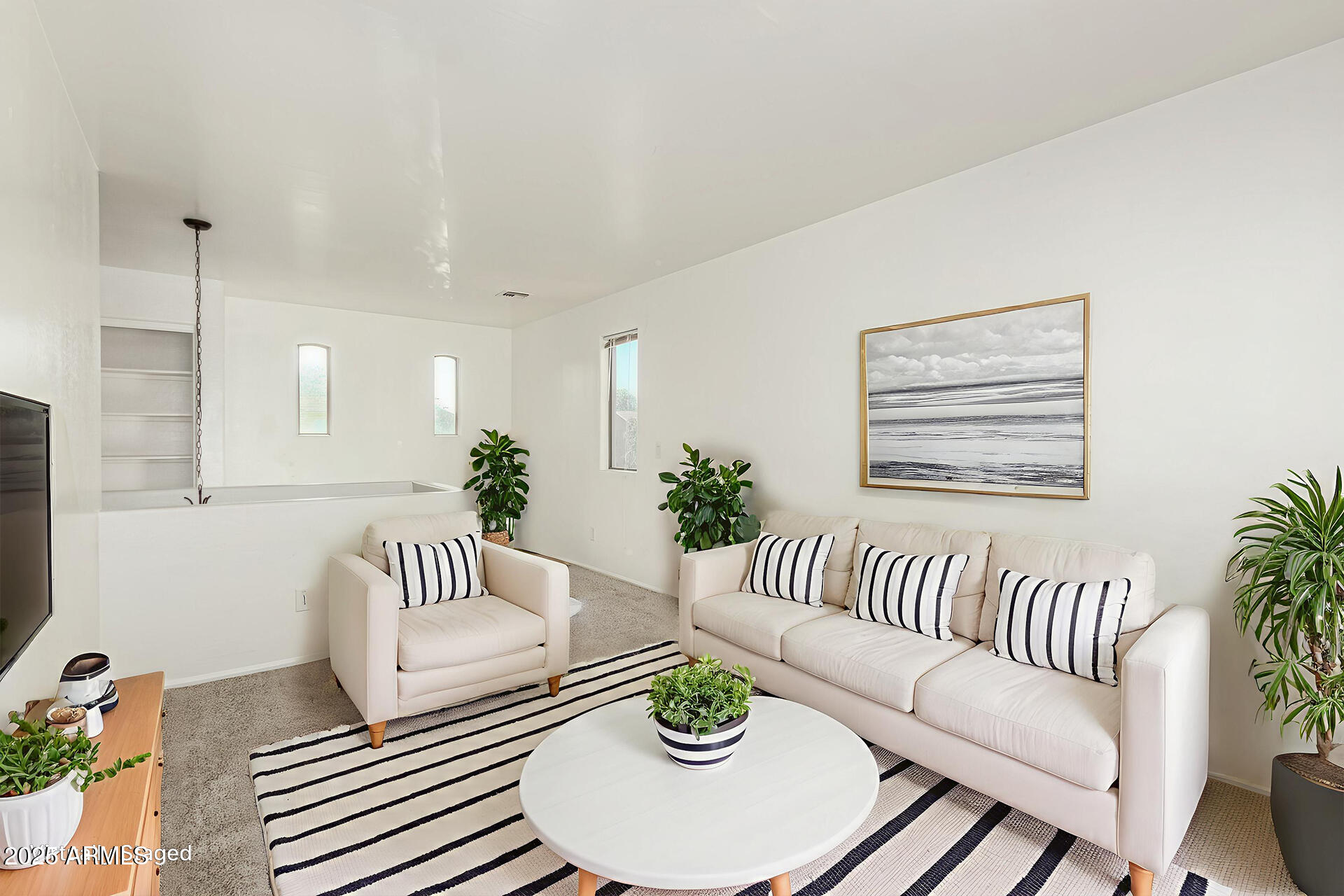 7596 West Charter Oak Road Peoria, AZ 85381 - Photo 14 of 29 a living room with furniture and a couch