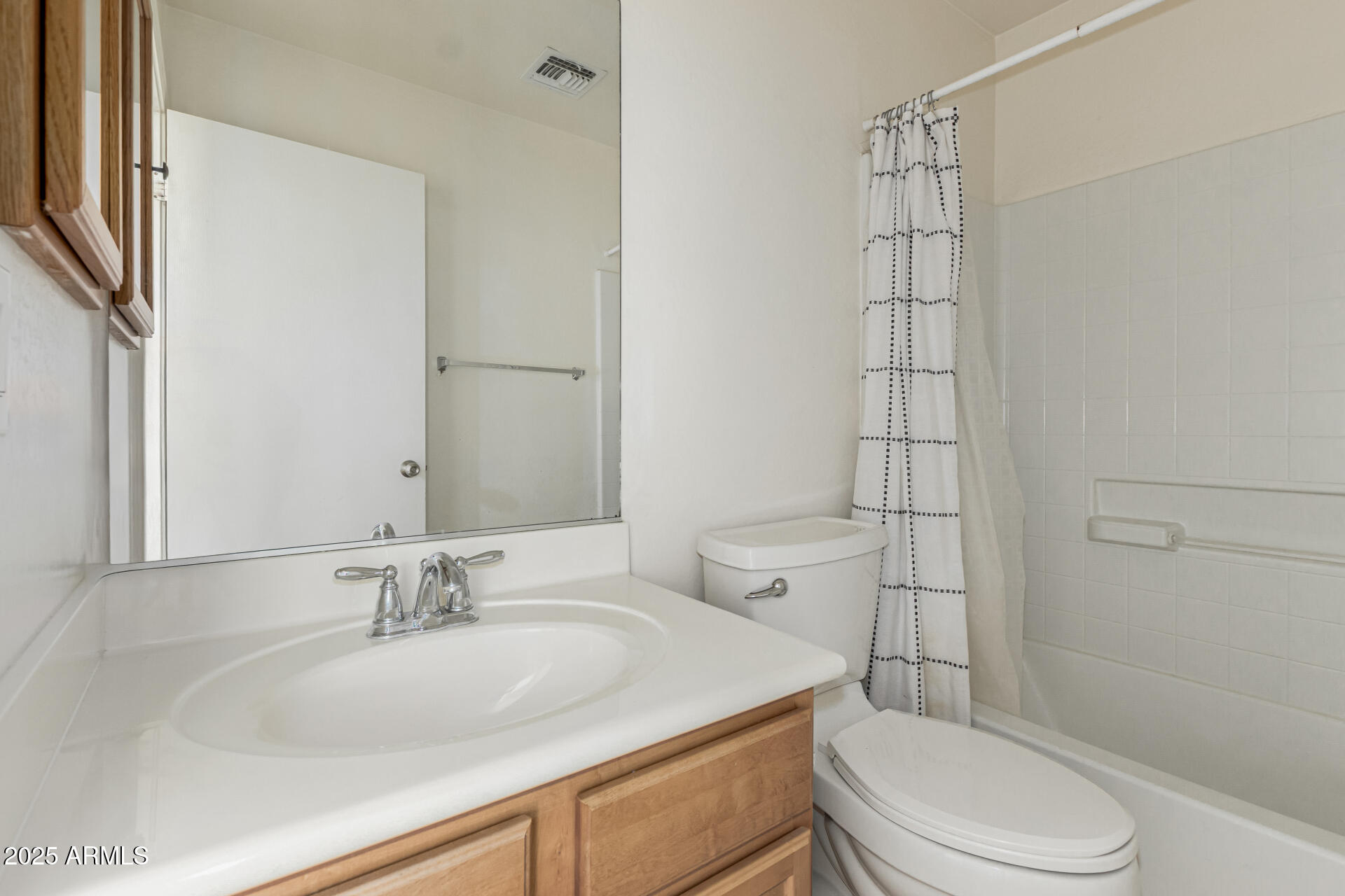 7596 West Charter Oak Road Peoria, AZ 85381 - Photo 23 of 29 a bathroom with a sink toilet vanity and shower