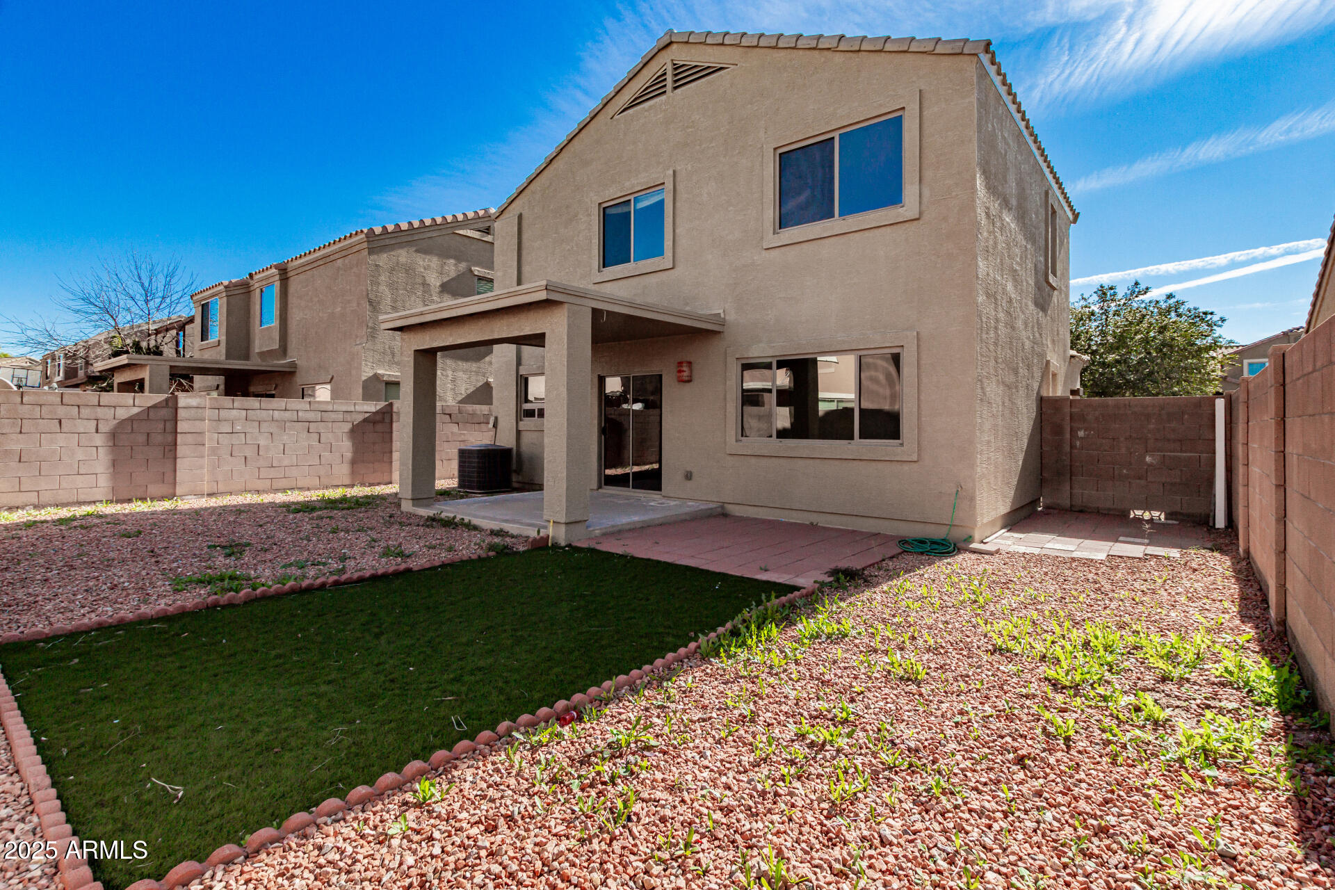 7596 West Charter Oak Road Peoria, AZ 85381 - Photo 26 of 29 a front view of a house with a yard
