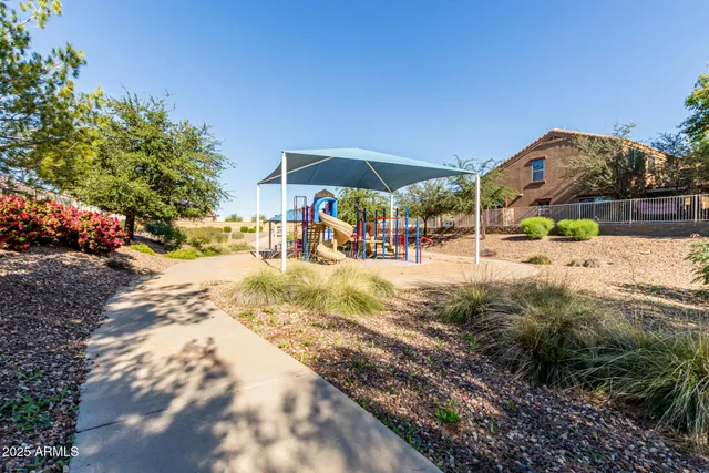 a view of swimming pool with a patio