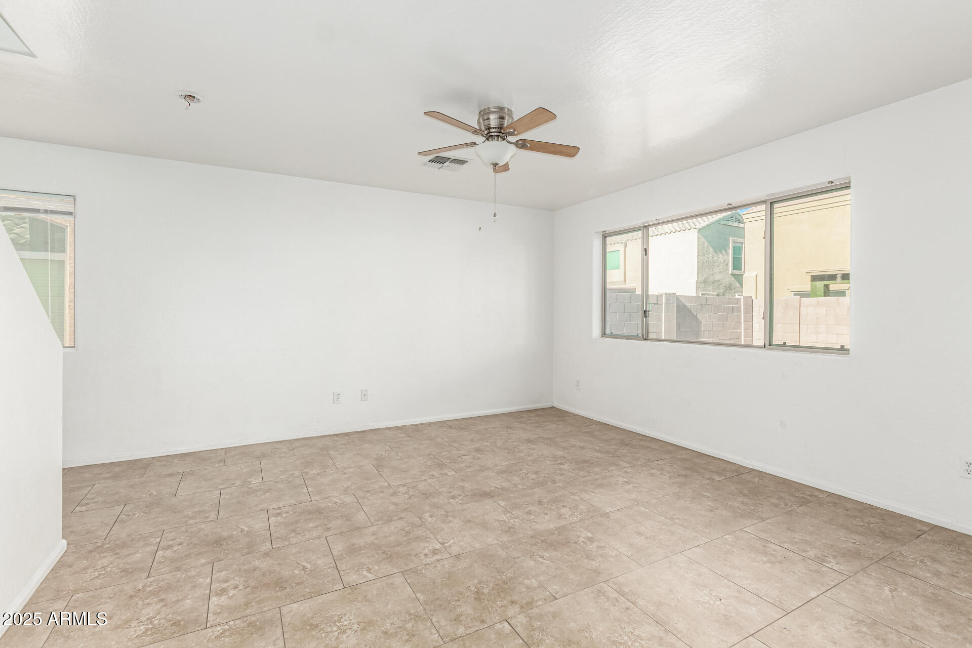 7596 West Charter Oak Road Peoria, AZ 85381 - Photo 6 of 29 a view of an empty room with a window