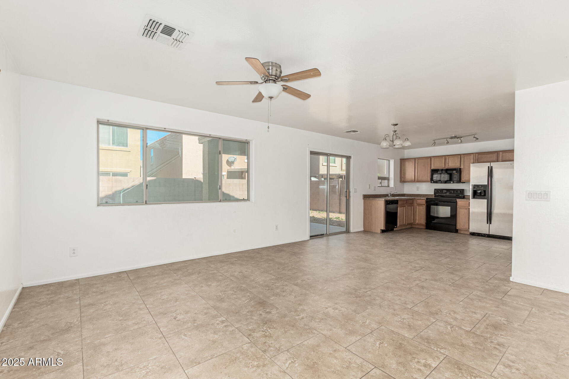 7596 West Charter Oak Road Peoria, AZ 85381 - Photo 7 of 29 a view of an empty room with a window