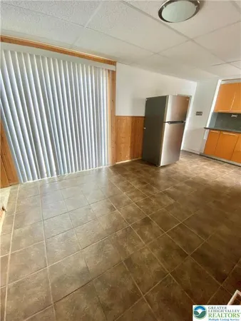a view of livingroom with furniture and closet