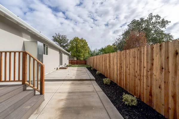 a backyard of a house with a yard and garage