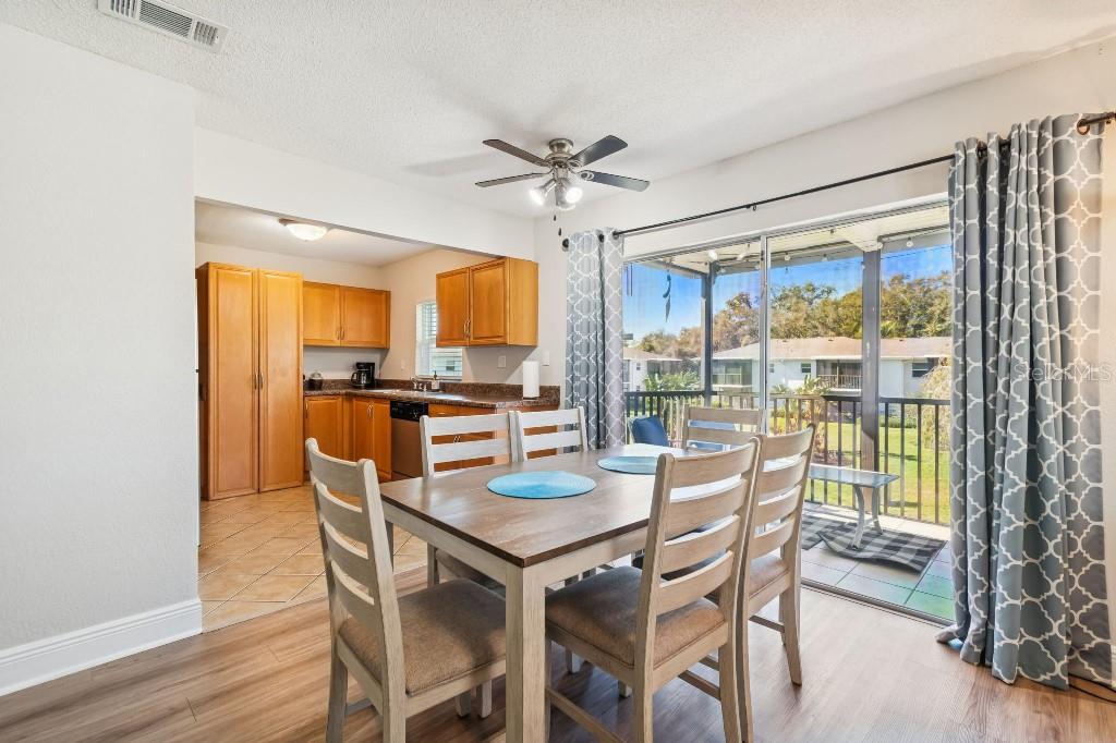 13125 Wilcox Road, Unit 6205 Largo, FL 33774 - Photo 7 of 48 a view of a dining room with furniture window and wooden floor