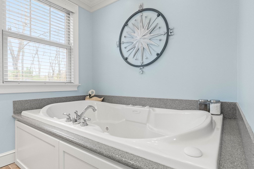 4 Birchmeadow Road Amesbury, MA 01913 - Photo 27 of 42 a bathroom with a bathtub and a window