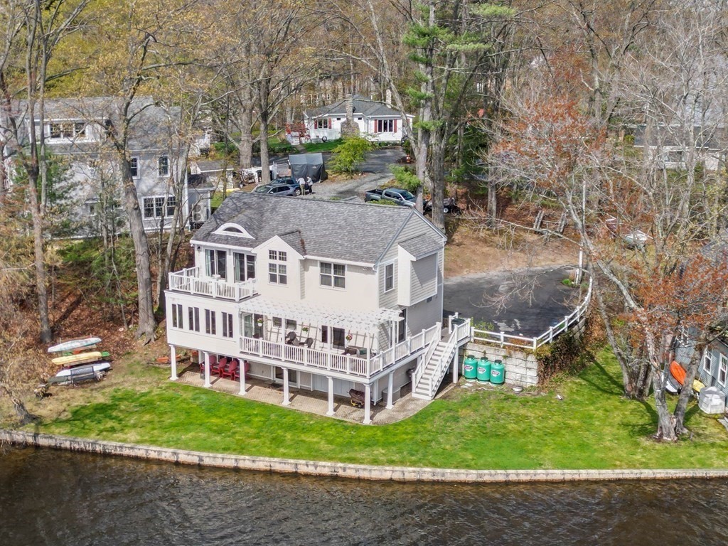 4 Birchmeadow Road Amesbury, MA 01913 - Photo 3 of 42 a view of a house with a yard and large trees