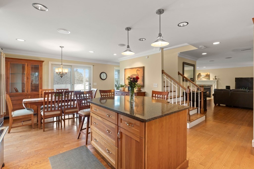 4 Birchmeadow Road Amesbury, MA 01913 - Photo 9 of 42 a dining room with furniture and a chandelier