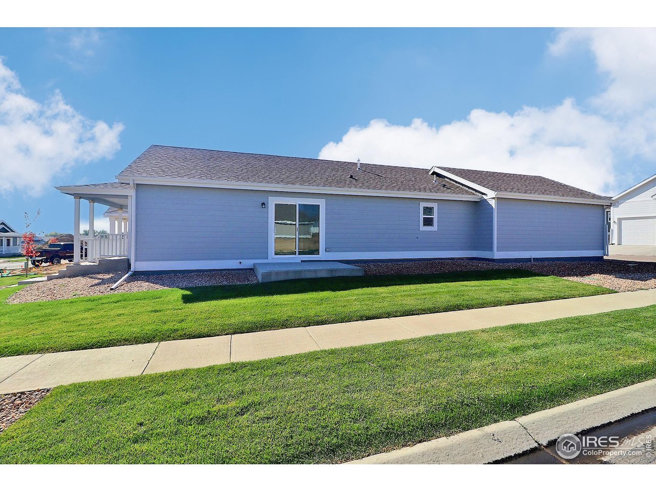 4301 Rockcress Road Evans, CO 80620 - Photo 25 of 26 a front view of a house with a yard