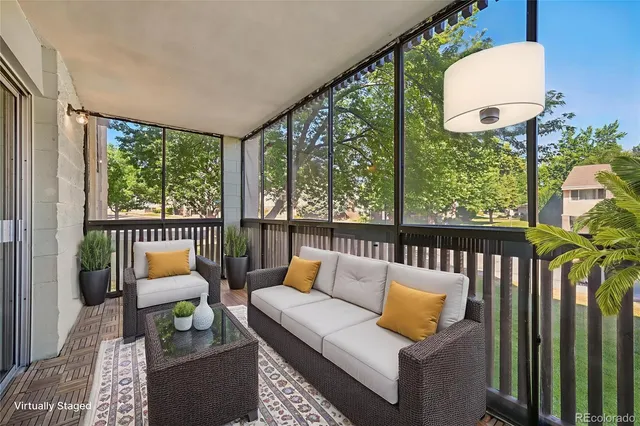 a living room with furniture and a table