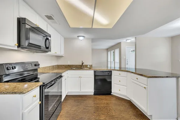 a view of a kitchen that has a window
