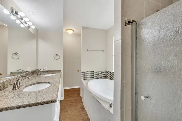 an empty room with closet and a chandelier fan