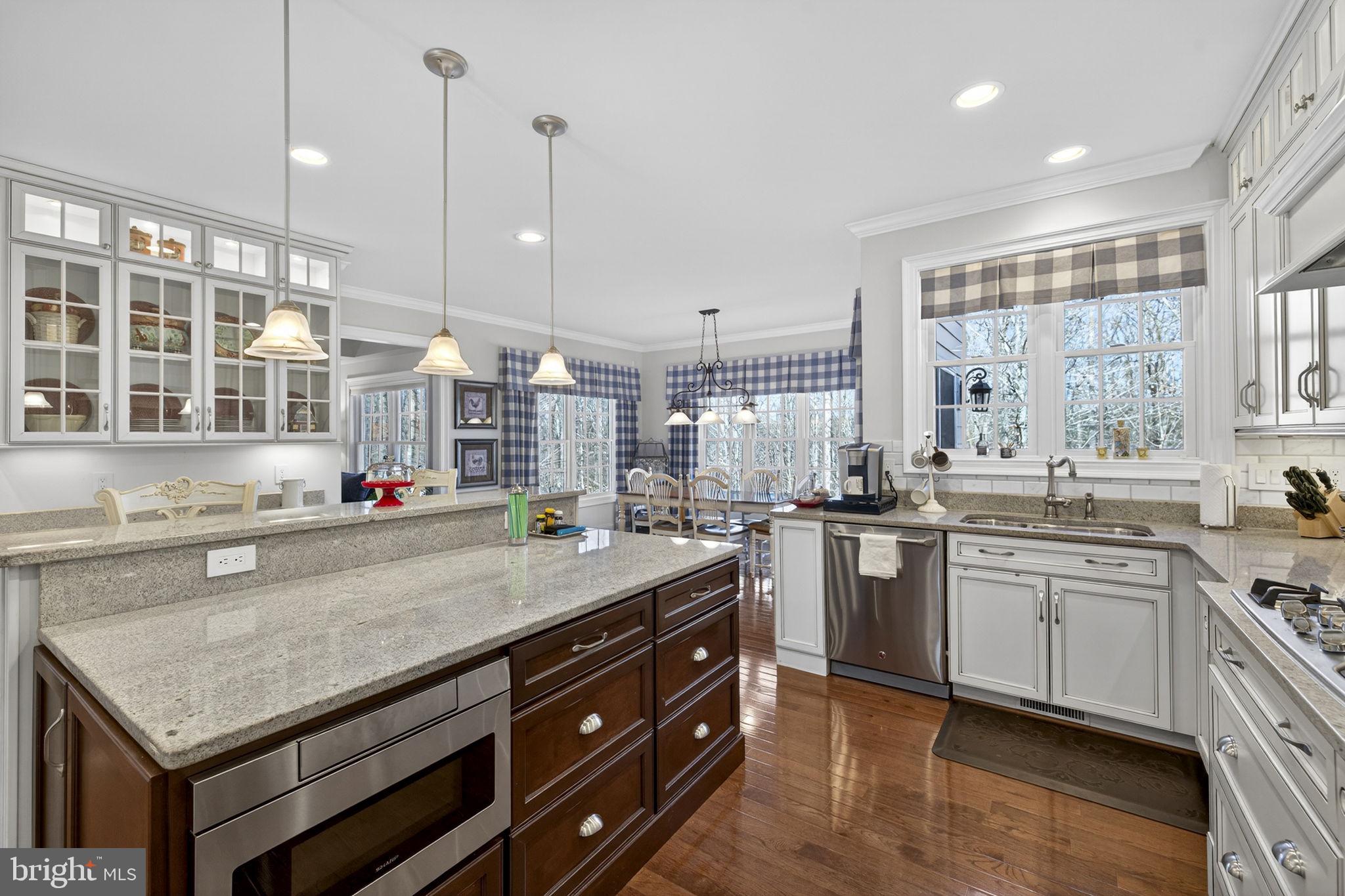 8485 Rogues Road Warrenton, VA 20187 - Photo 17 of 121 a kitchen with sink stove and cabinets