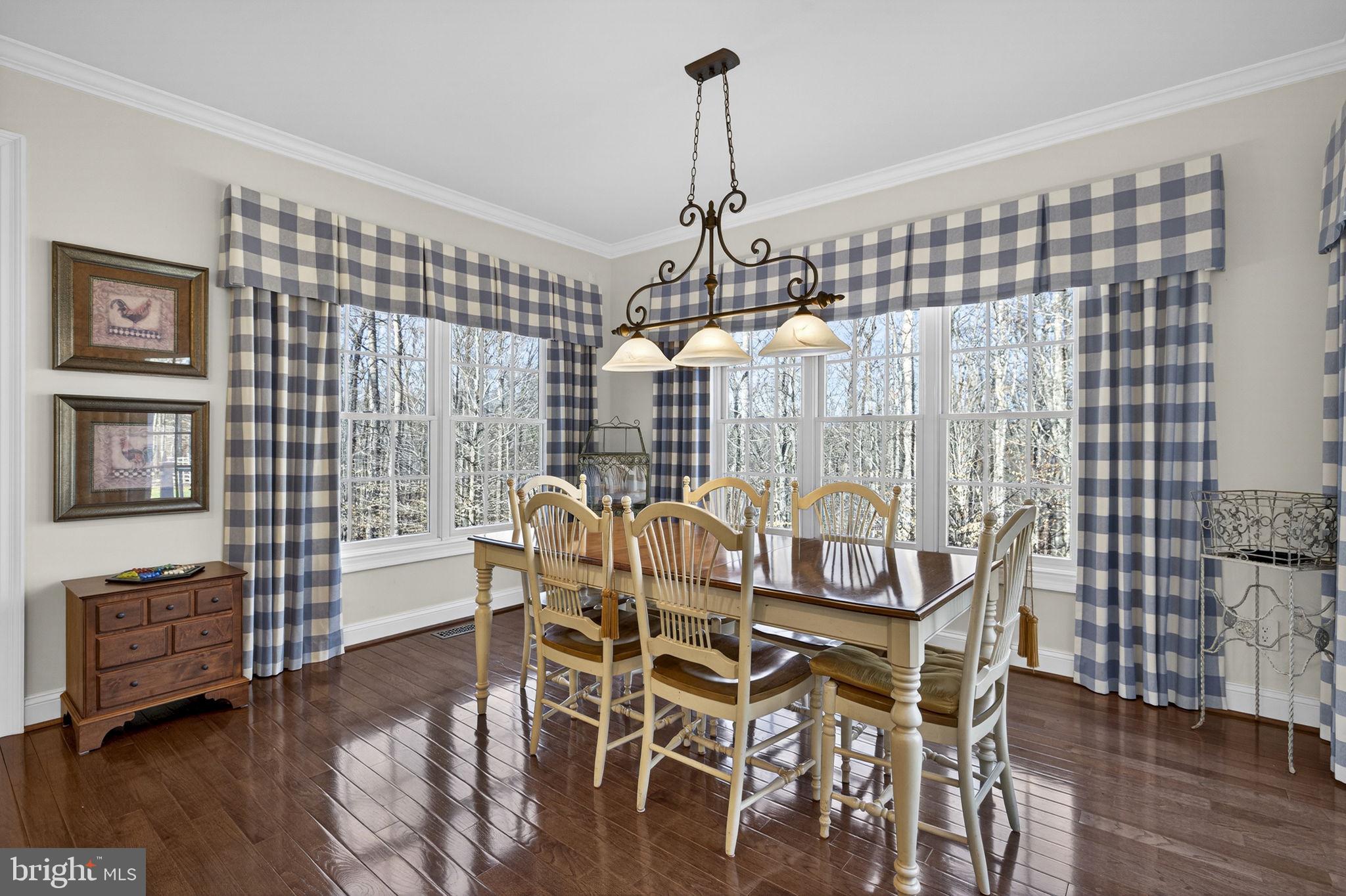 8485 Rogues Road Warrenton, VA 20187 - Photo 18 of 121 a view of a dining room with furniture window and wooden floor