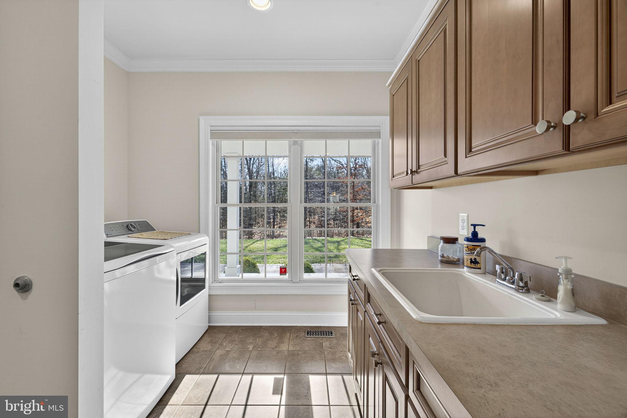8485 Rogues Road Warrenton, VA 20187 - Photo 21 of 121 a kitchen with a sink a stove and a microwave oven