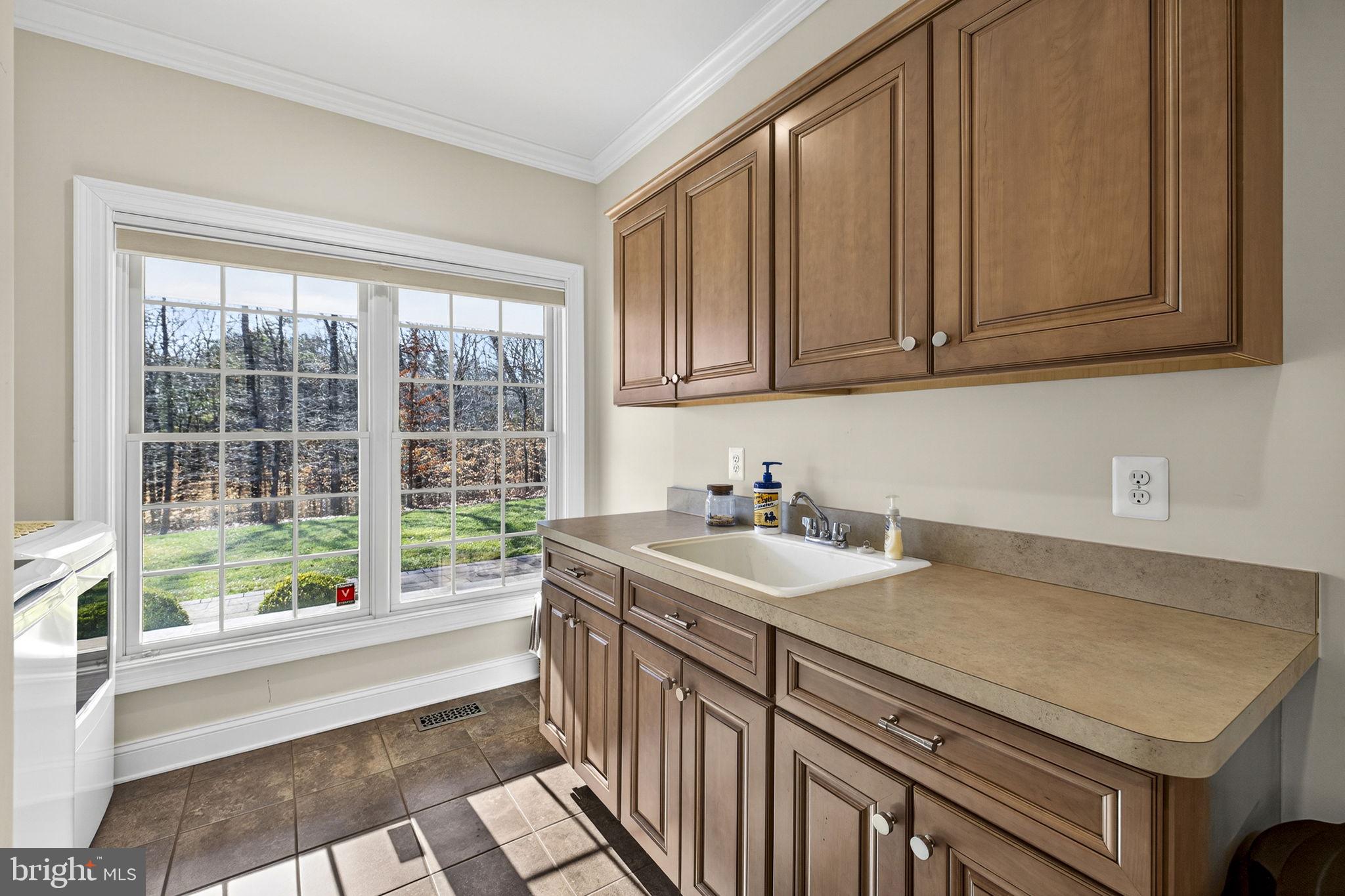 8485 Rogues Road Warrenton, VA 20187 - Photo 22 of 121 a kitchen with a sink and a window