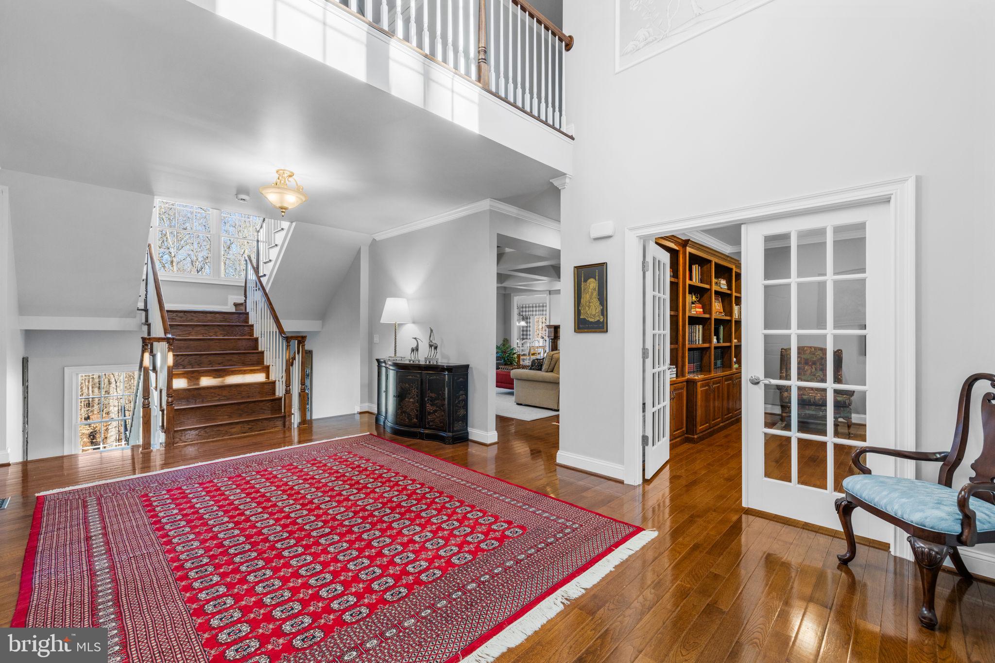 8485 Rogues Road Warrenton, VA 20187 - Photo 24 of 121 a living room with furniture a rug and a fireplace