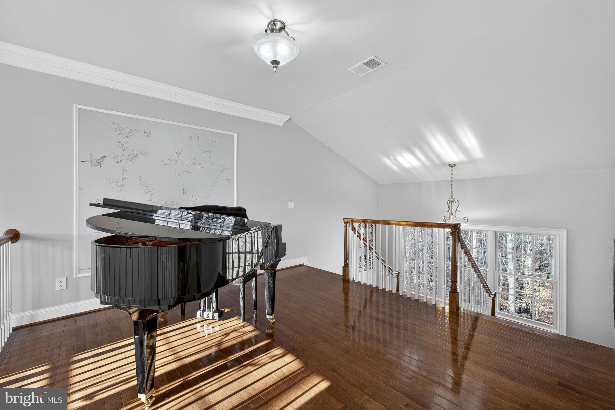 8485 Rogues Road Warrenton, VA 20187 - Photo 26 of 121 a living room with furniture and wooden floor