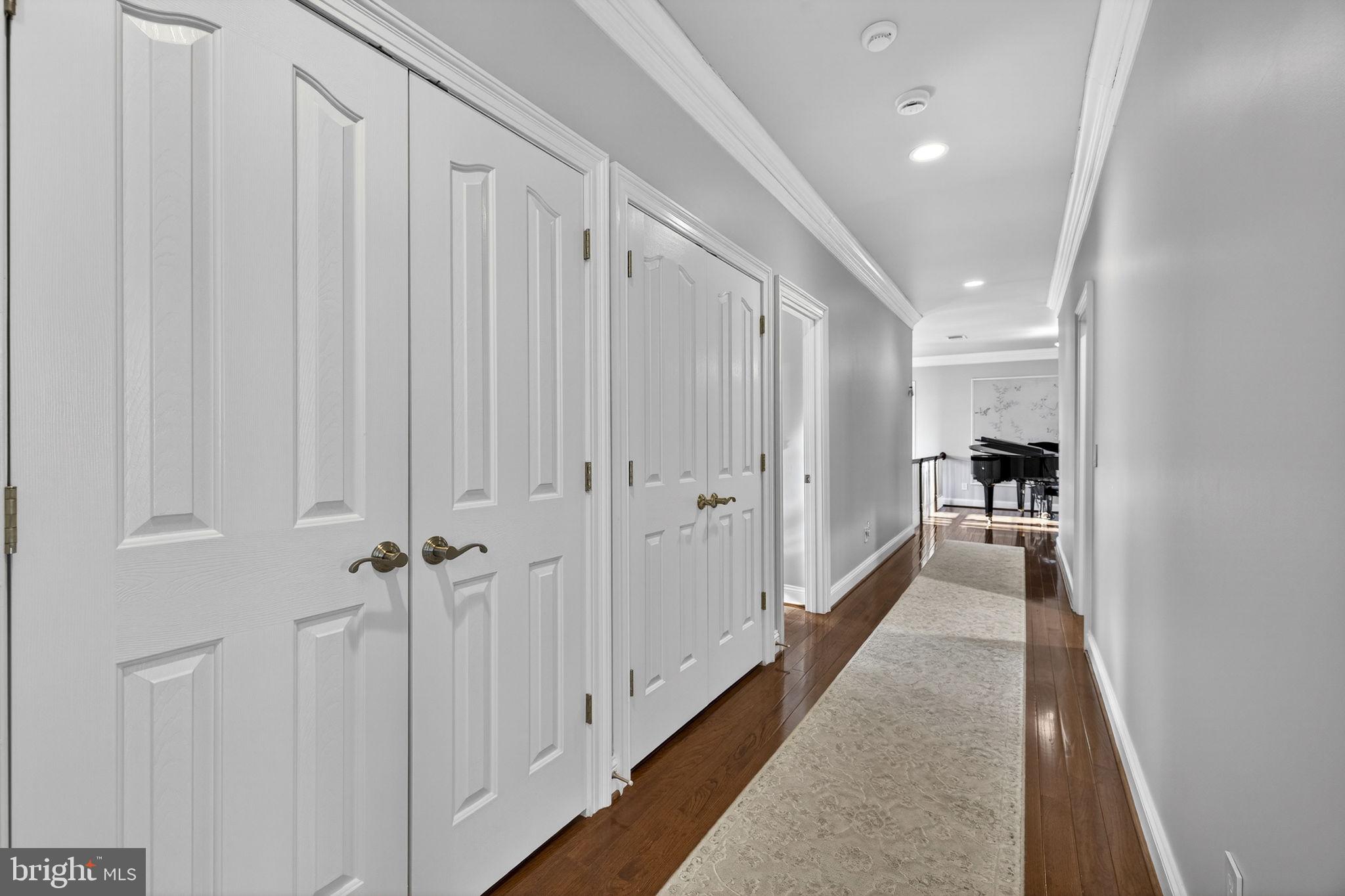 8485 Rogues Road Warrenton, VA 20187 - Photo 27 of 121 a view of a hallway with white walls and stairs