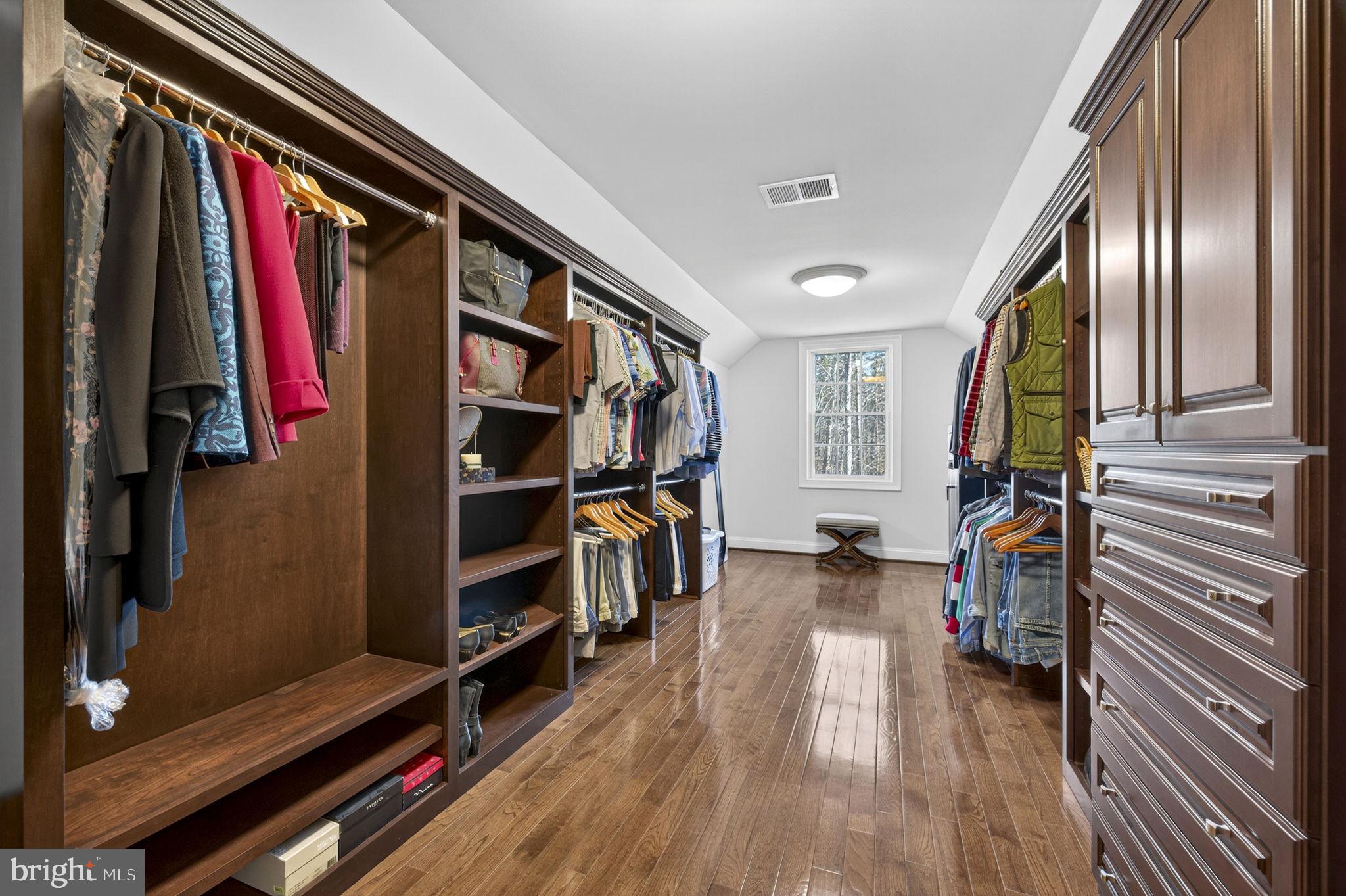 8485 Rogues Road Warrenton, VA 20187 - Photo 34 of 121 a view of walk in closet with clothes and shoes