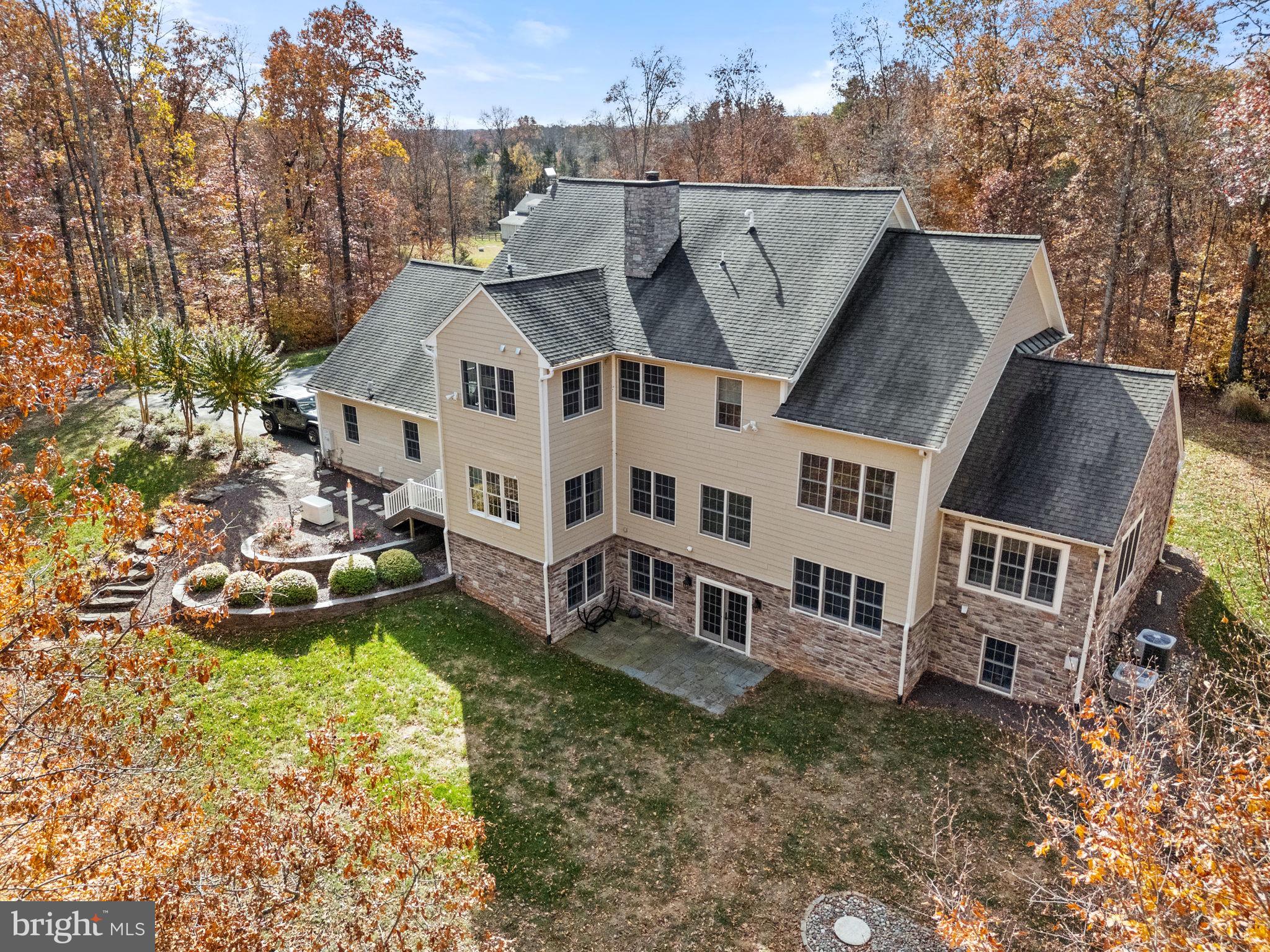 8485 Rogues Road Warrenton, VA 20187 - Photo 55 of 121 an aerial view of a house with a yard