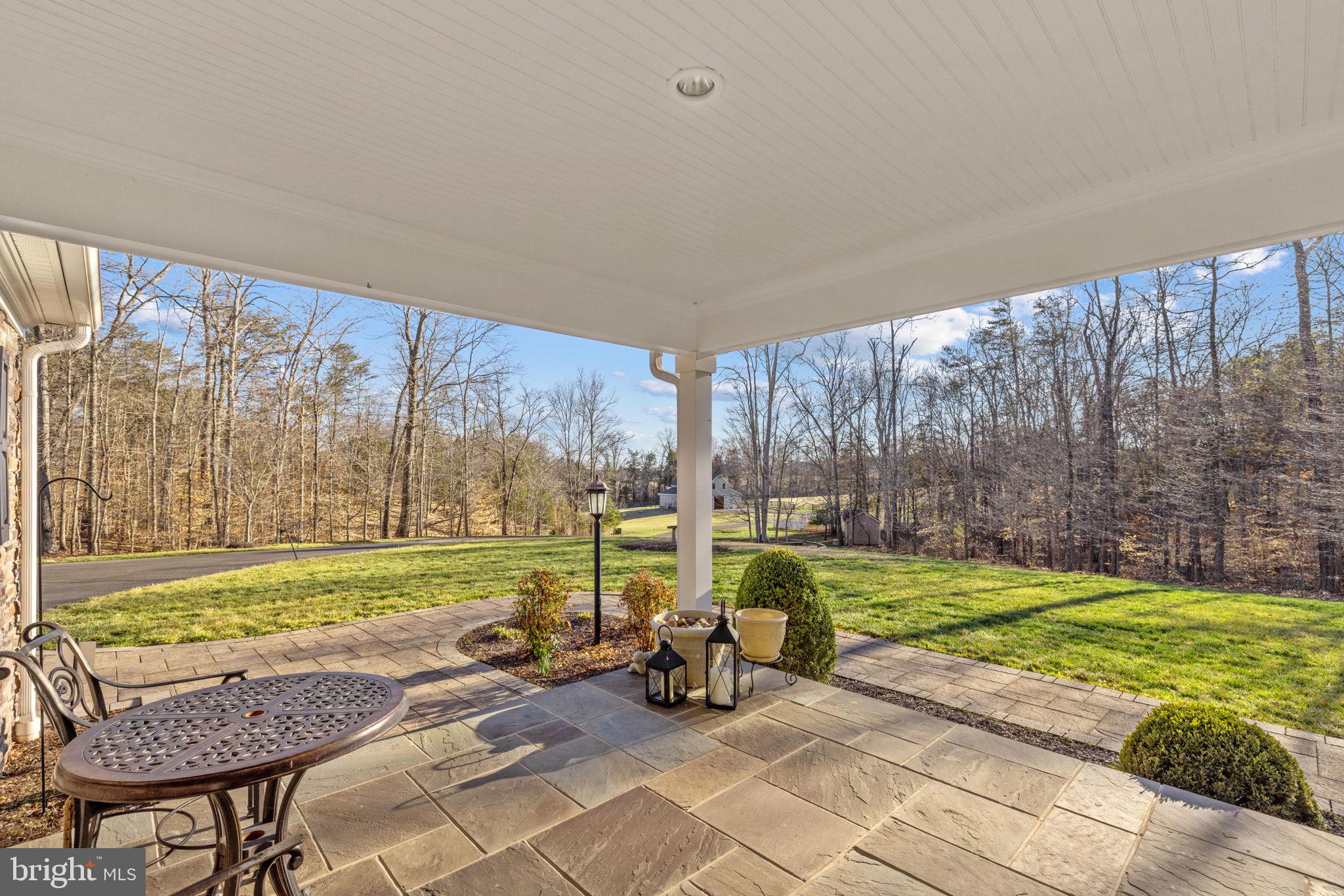 8485 Rogues Road Warrenton, VA 20187 - Photo 62 of 121 a view of a swimming pool with lawn chairs and a yard