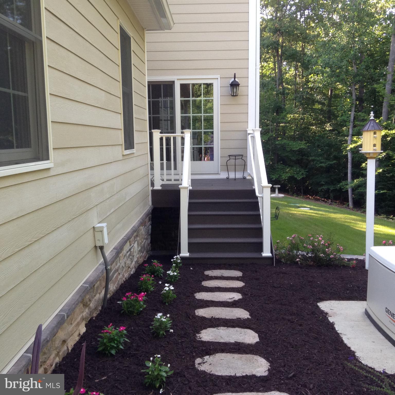 8485 Rogues Road Warrenton, VA 20187 - Photo 63 of 121 a view of a house with backyard and a garden