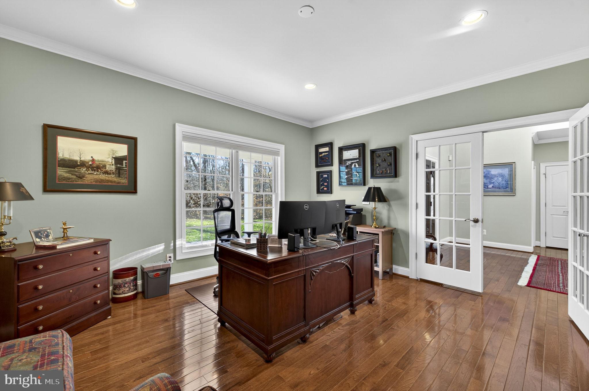 8485 Rogues Road Warrenton, VA 20187 - Photo 9 of 121 a living room with furniture windows and a flat screen tv