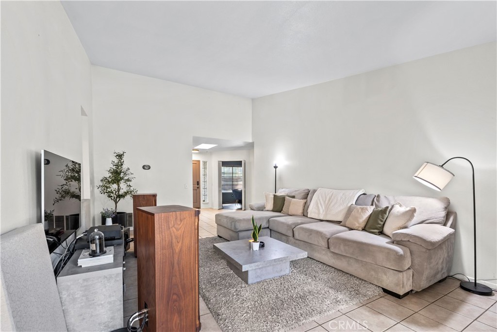 28046 Millar Street Highland, CA 92346 - Photo 16 of 39 a living room with furniture rug and lamp