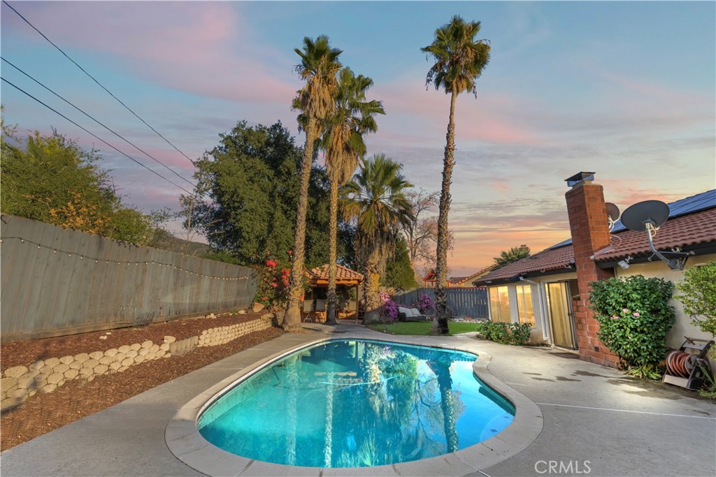 28046 Millar Street Highland, CA 92346 - Photo 2 of 39 a view of a house with pool and a yard