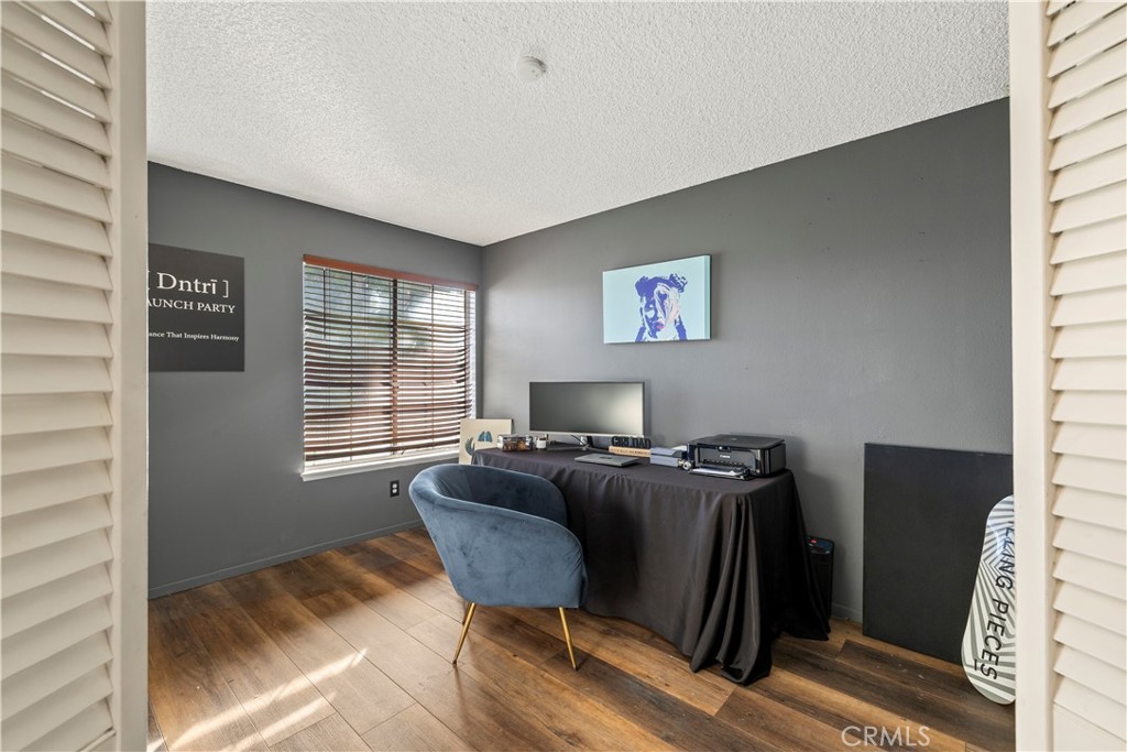 28046 Millar Street Highland, CA 92346 - Photo 22 of 39 a workspace with furniture and window