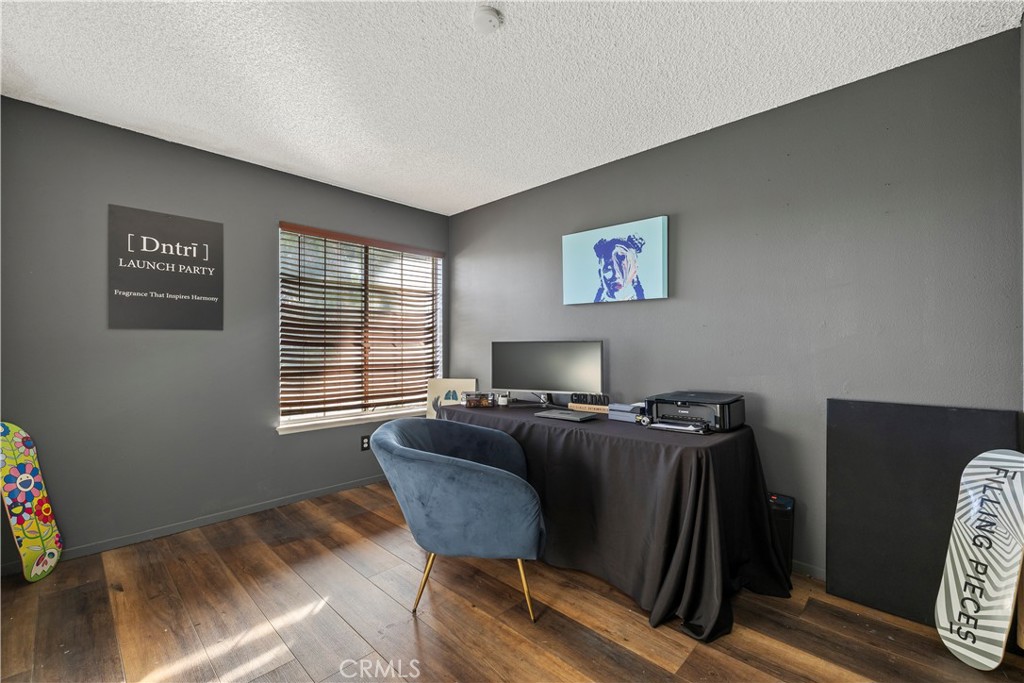 28046 Millar Street Highland, CA 92346 - Photo 24 of 39 a workspace with furniture and a window
