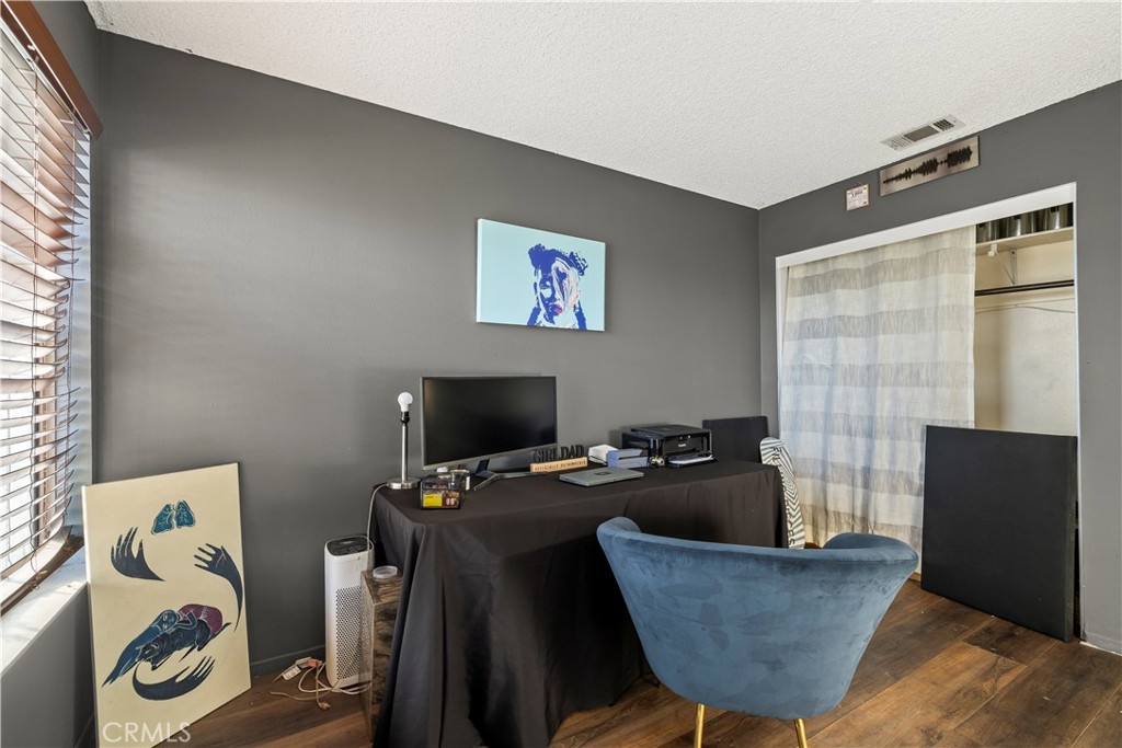 28046 Millar Street Highland, CA 92346 - Photo 25 of 39 a living room with furniture and a flat screen tv