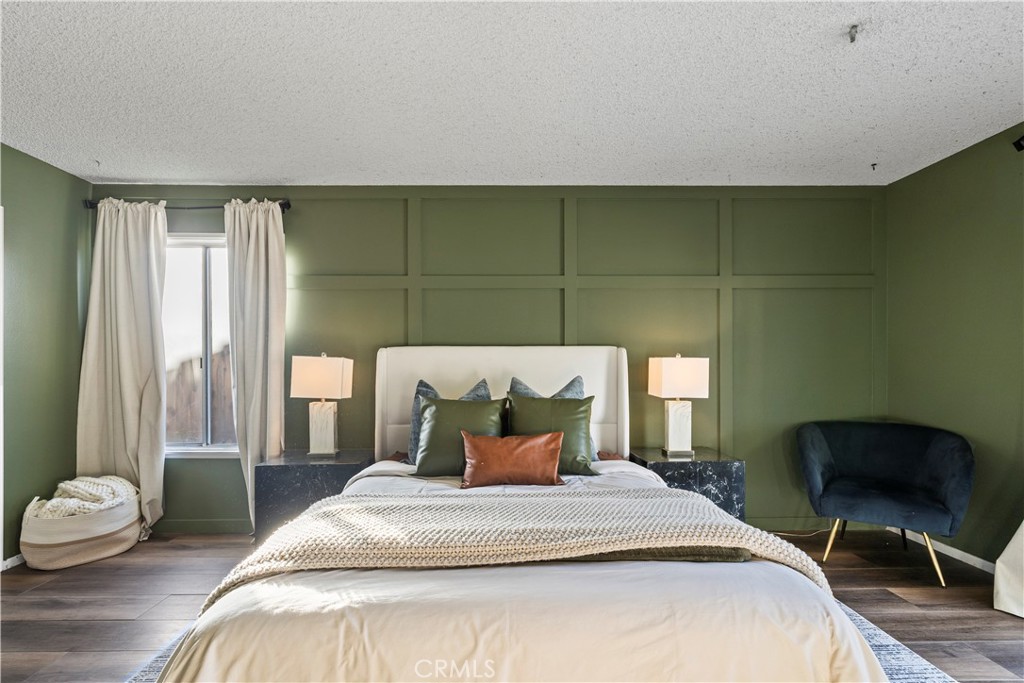 28046 Millar Street Highland, CA 92346 - Photo 30 of 39 a bedroom with a bed and chair