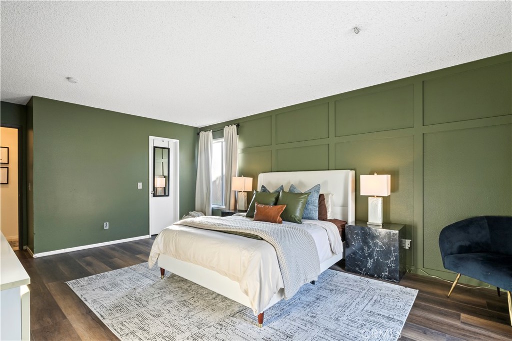 28046 Millar Street Highland, CA 92346 - Photo 31 of 39 a bedroom with a large bed and a rug