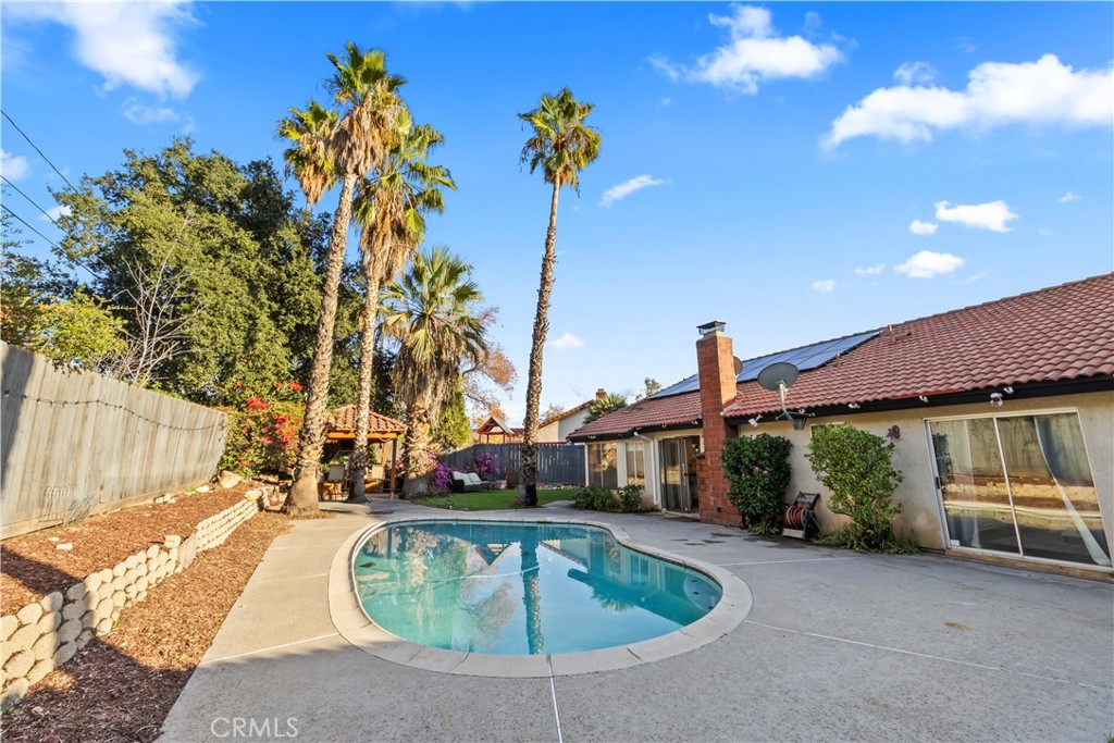 28046 Millar Street Highland, CA 92346 - Photo 36 of 39 a front view of a house with a garden