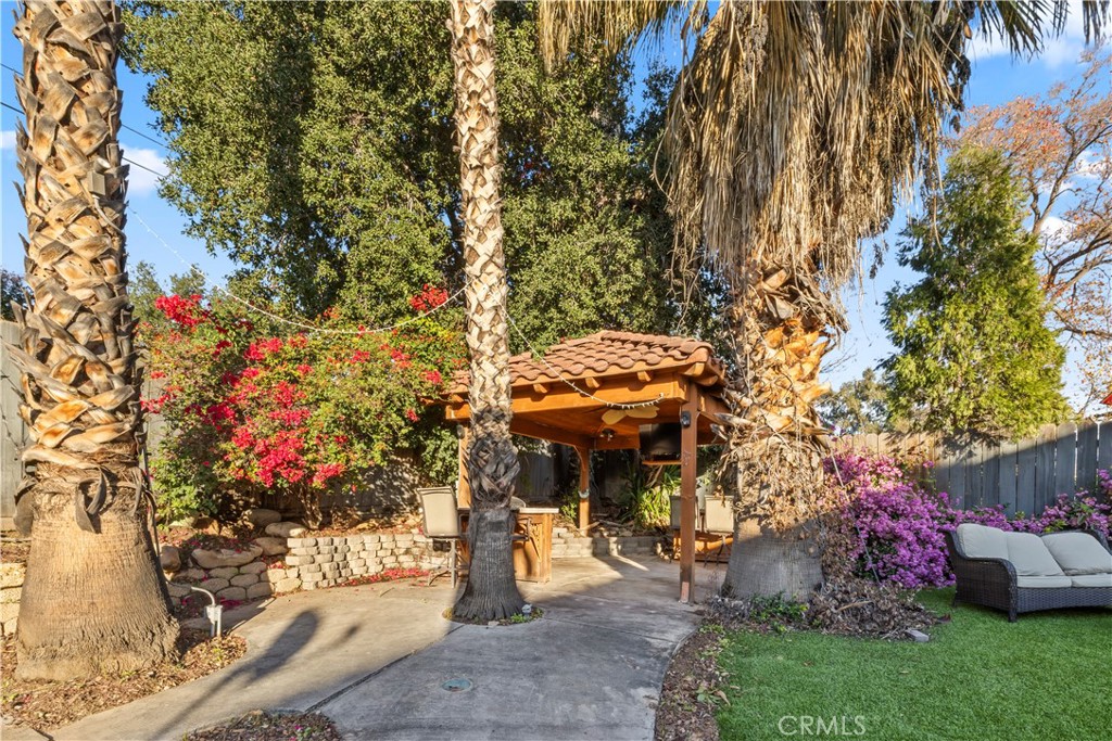 28046 Millar Street Highland, CA 92346 - Photo 37 of 39 a view of a house with a backyard and garden