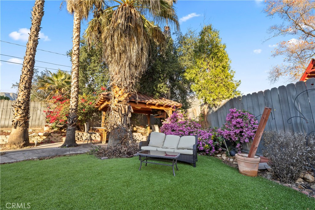 28046 Millar Street Highland, CA 92346 - Photo 39 of 39 a garden view with a seating space