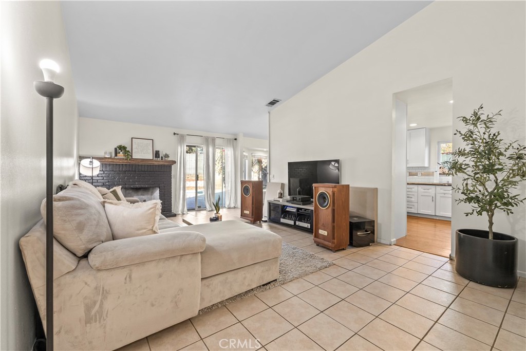 28046 Millar Street Highland, CA 92346 - Photo 4 of 39 a living room with furniture and a flat screen tv