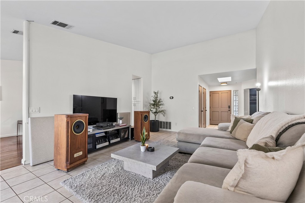 28046 Millar Street Highland, CA 92346 - Photo 5 of 39 a living room with furniture and a flat screen tv
